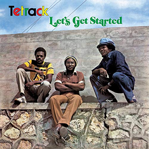 Album cover with three men sitting on a stone wall, multicolored text above.