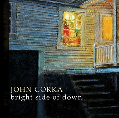 "Album cover art: a house at night with lit windows, artist and title text."