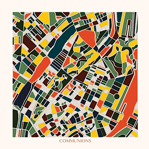 A vinyl record cover featuring a colorful abstract cityscape design with the title "Communions".