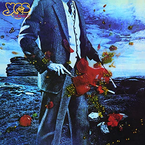 Yes album cover: a man in a suit with falling tomatoes and flowers.