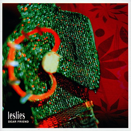 "Album cover with green fabric and red floral pattern, 'Leslies' and 'Dear Friend' text."