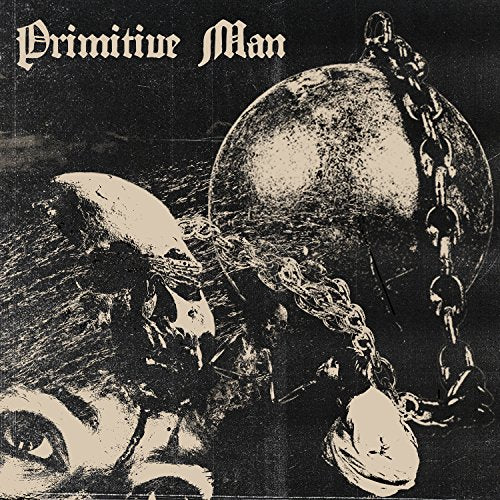 Dark album cover with a face, chains, and a large metal ball.