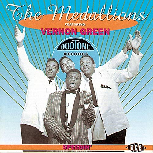 "Album cover featuring four men in suits against a blue background with orange accents."