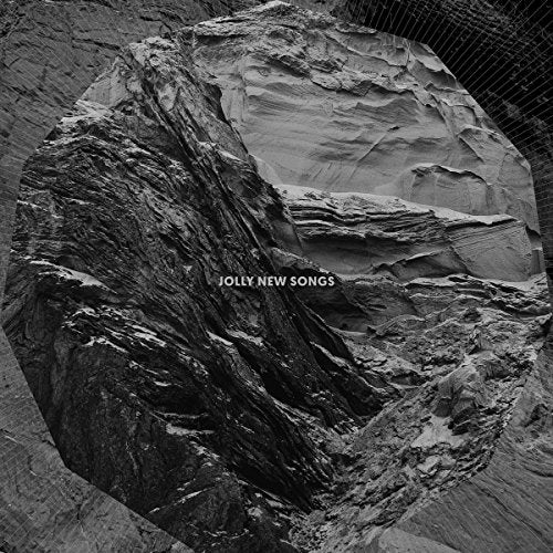 Black and white album cover featuring a textured, rocky landscape.