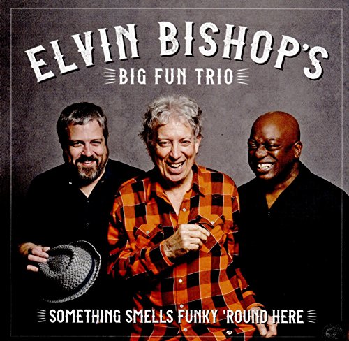 CD album cover featuring three men, one holding a hat, against a gray background.