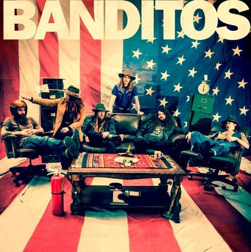 "Album cover featuring a band lounging in front of an American flag backdrop."