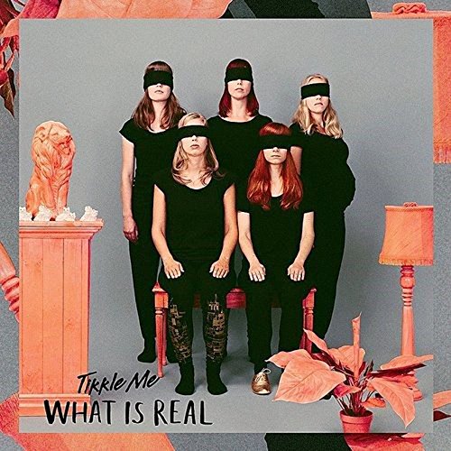 Vinyl album cover featuring six women in black, some wearing blindfolds.