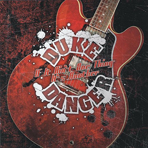 Red electric guitar with white text: "Danger, Duke" and album title.