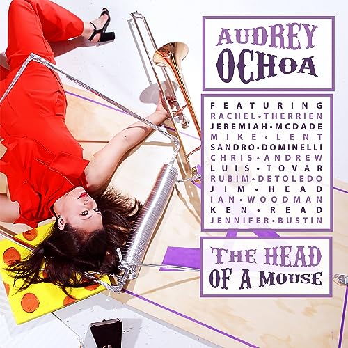 CD cover: woman in red, trombone, and text reading "The Head Of A Mouse".