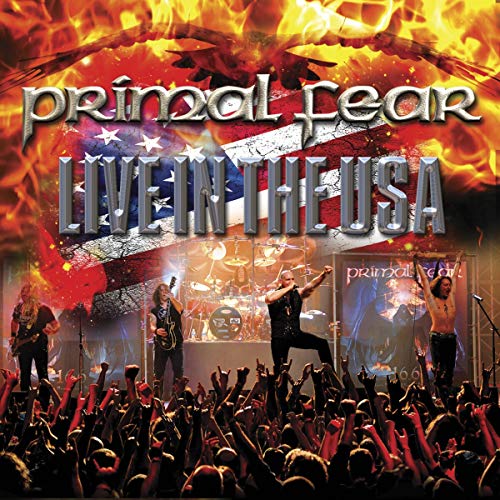 "CD cover featuring Primal Fear performing on stage with a flaming US flag."