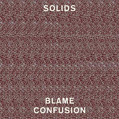 The image is a red-brown textured background with white text. Alt text: Red-brown textured background with "SOLIDS BLAME CONFUSION" in white text.