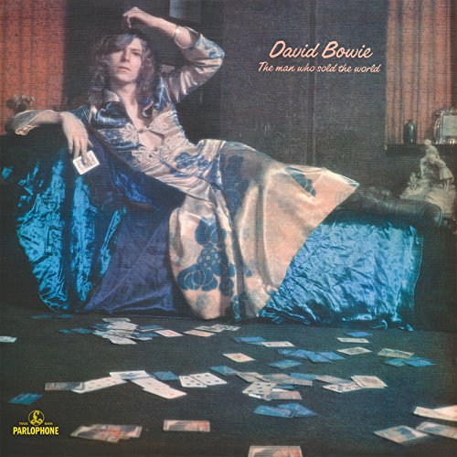 David Bowie album cover with man lounging on couch surrounded by playing cards.