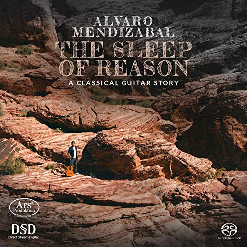 CD cover with a man standing on rocky terrain, holding a guitar case.