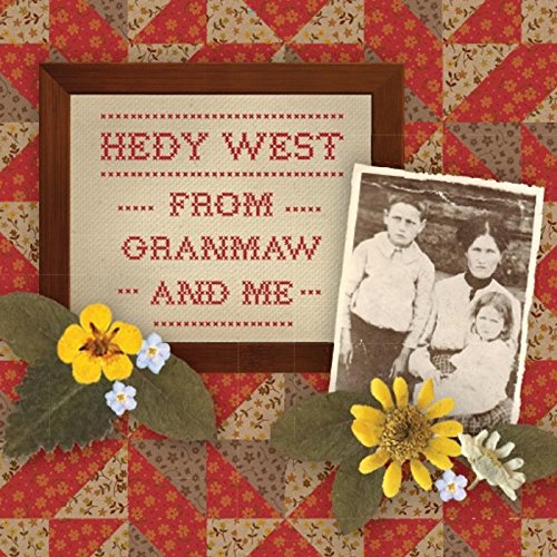Album cover with framed cross-stitch text and vintage family photo, surrounded by flowers and quilt pattern.