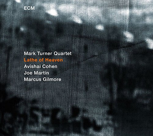 "Album cover with dark, blurry cityscape and white and orange text listing the artists."