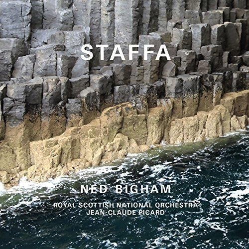 "Album cover featuring a rocky cliffside with crashing waves and white text overlay."