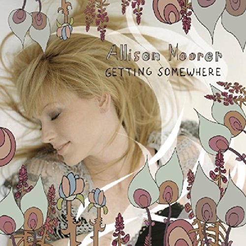 "Album cover with a blonde woman sleeping, surrounded by floral illustrations."