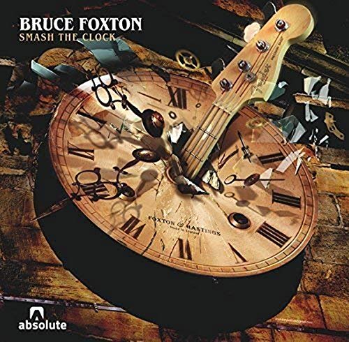 CD cover: broken clock with a bass guitar, album title visible.