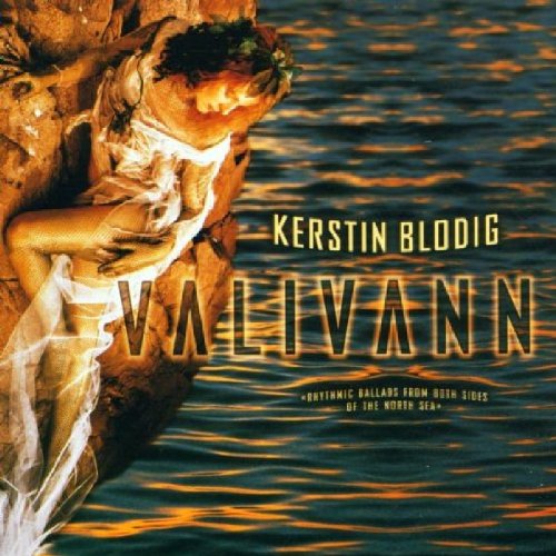 "Album cover: woman in white dress leaning on a rock by water."