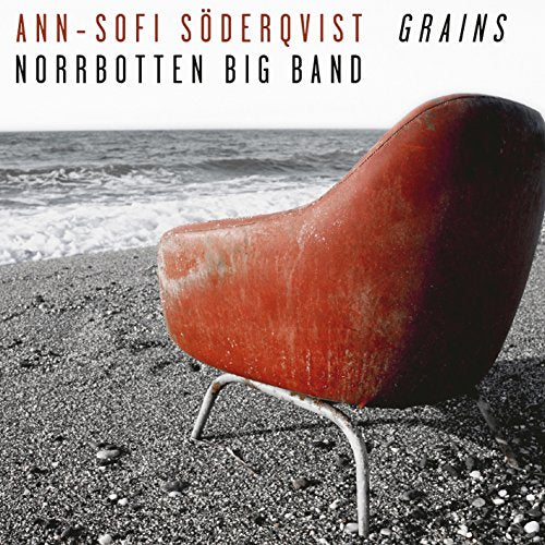 "CD cover featuring a red chair on a beach with ocean waves."