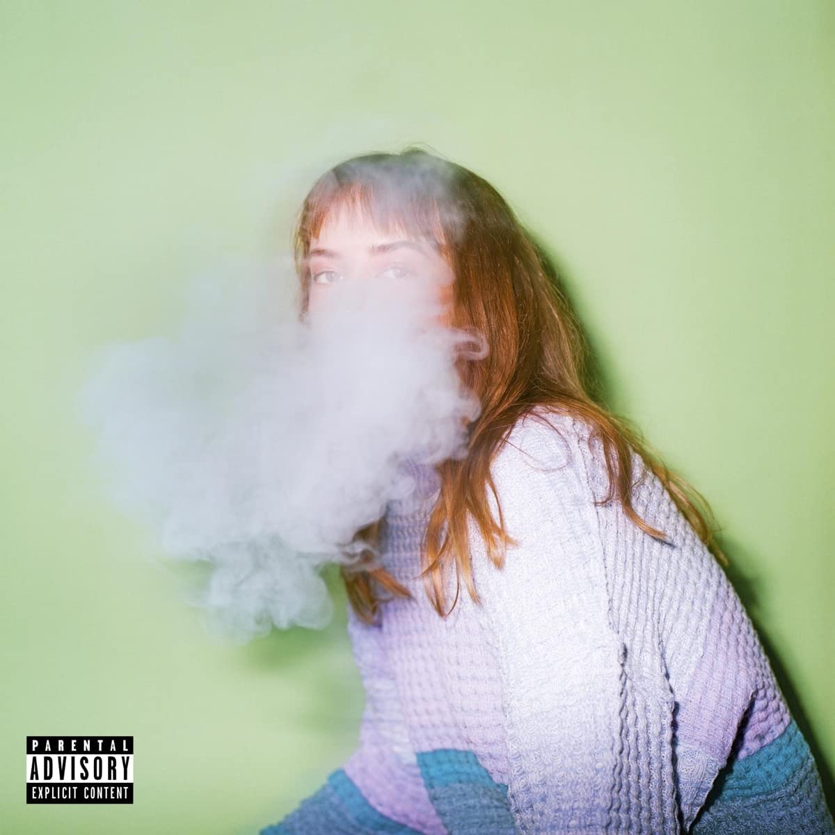 CD cover: woman with smoke, wearing a lavender sweater, green background.