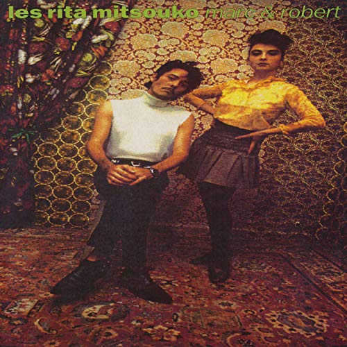 Les Rita Mitsouko album cover: two people posing against a patterned backdrop.