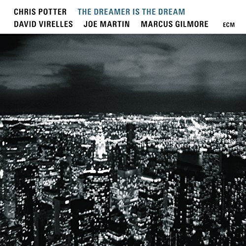 Album cover with a black-and-white cityscape at night and the title "The Dreamer is the Dream".