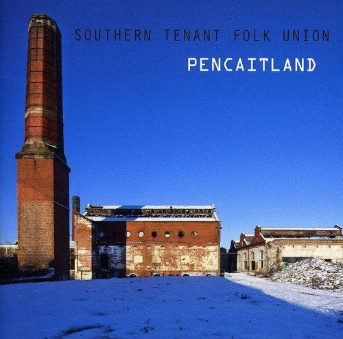 "Album cover featuring a snowy abandoned brick factory with a tall chimney."