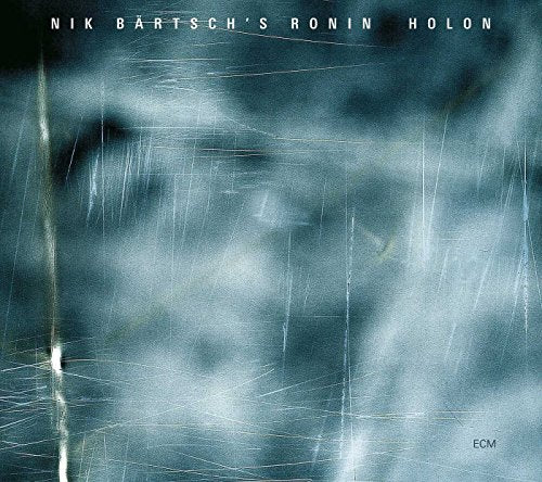 Album cover with scratched, dark blue-gray background and white text "Nik Bärtsch's Ronin Holon".