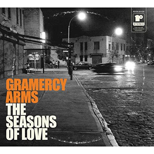 Black and white city street album cover with orange and white text overlay.