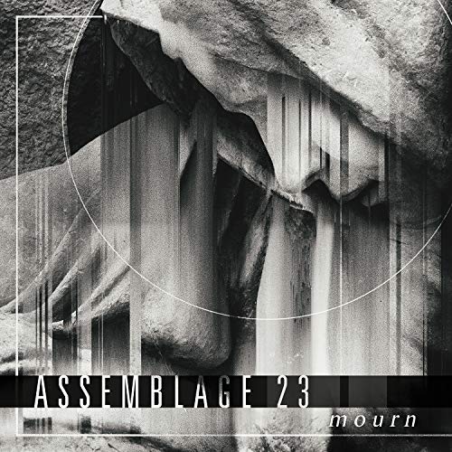 "Black and white album cover with abstract rock formation and 'Assemblage 23 - Mourn' text."