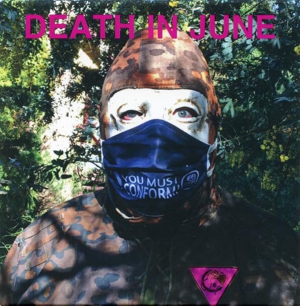 Figure in hooded mask and face covering, camouflage and leopard print.