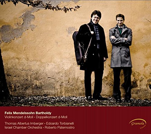 "Album cover with two men standing against a weathered wall, red banner at bottom."