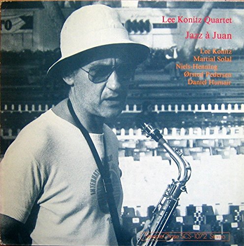 "Album cover with man in hat holding saxophone, text listing artists and title."