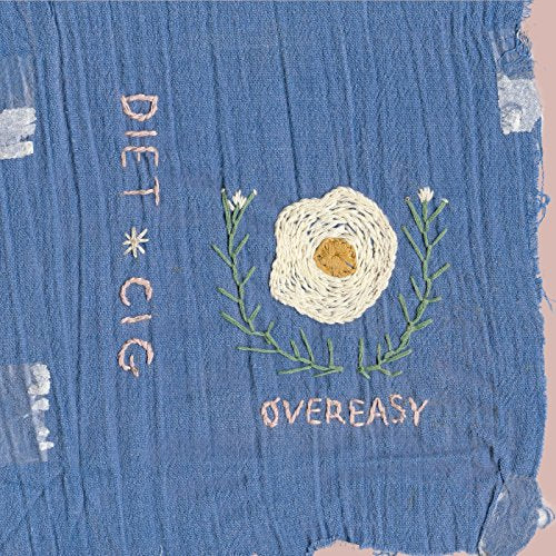 Blue denim album cover with embroidered fried egg and text.