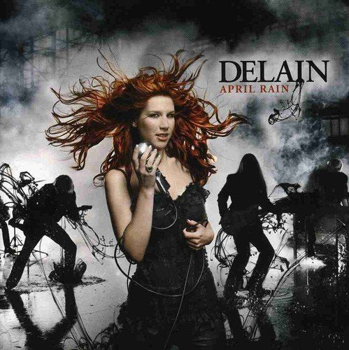"CD case cover featuring a woman with flowing red hair and black dress."
