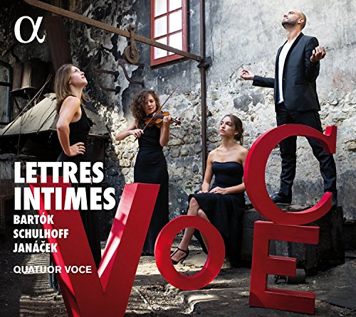 "CD cover featuring four musicians posing with large red letters spelling 'VOCE'."