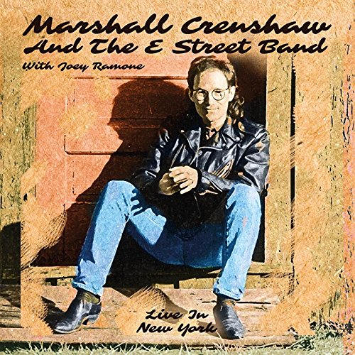 "CD cover featuring Marshall Crenshaw sitting on steps, wearing leather jacket and jeans."