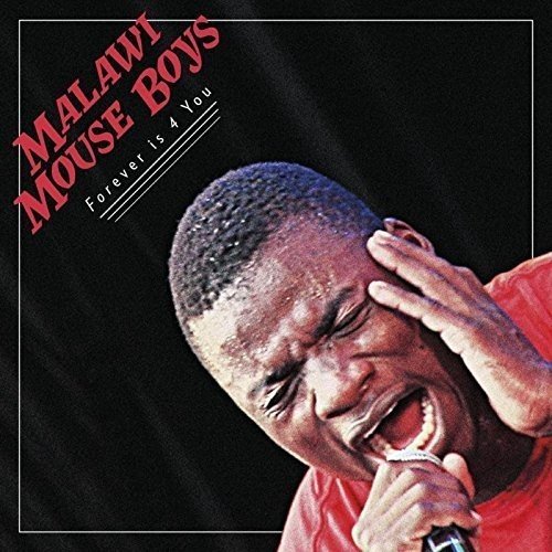 "Album cover with a man singing into a microphone, eyes closed, against a black background."