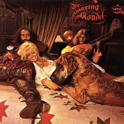 Album cover featuring a band, a dog, and a person on a bed.
