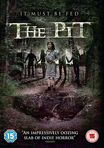 DVD cover for "The Pit" featuring a woman standing over a pit in the woods.