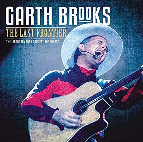 Garth Brooks in a cowboy hat playing an acoustic guitar.