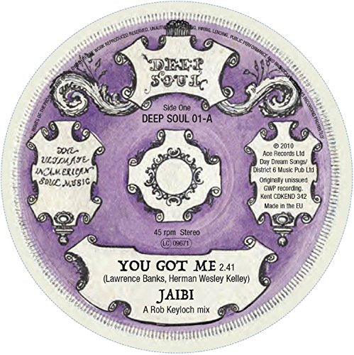 Vinyl record label with purple background and ornate white design elements.