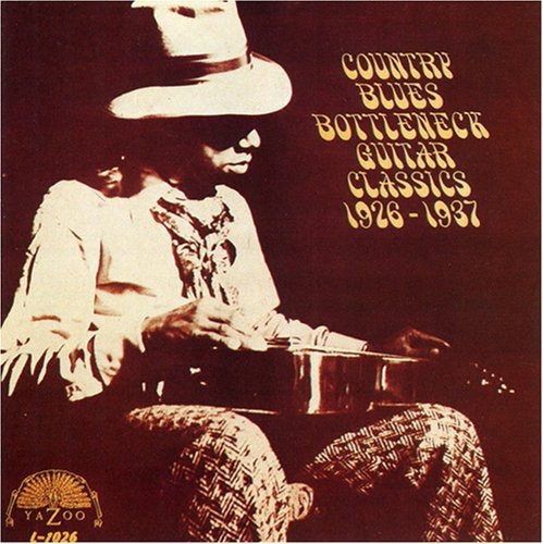 CD cover with a man playing guitar, wearing a hat, in sepia tone.