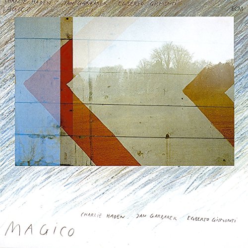 "Album cover with abstract geometric design and artist names, titled 'Magico'."