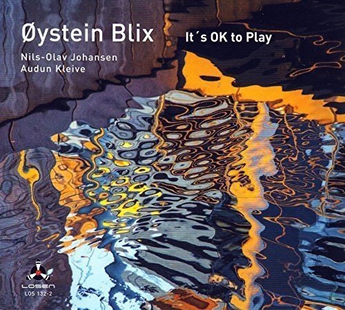 "Album cover with abstract water design and artist names in white text."