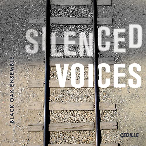 CD cover with railroad tracks and the text “Silenced Voices.”