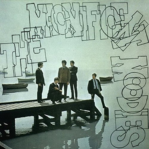 "Album cover with five men in suits standing on a dock."