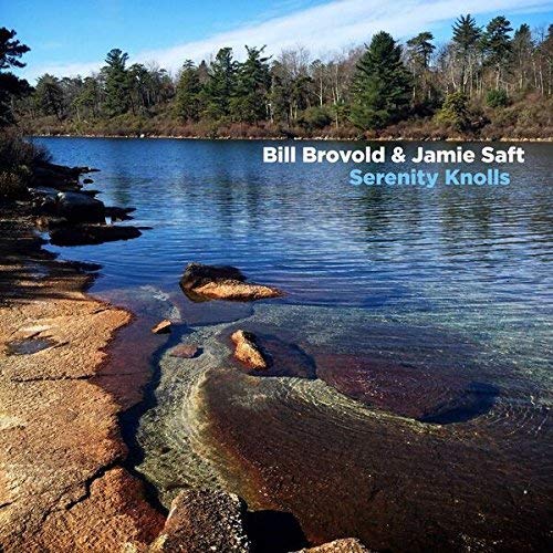 Lake scene with rocky shoreline, album title "Serenity Knolls" overlaid.