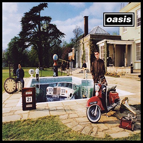 "Oasis vinyl album cover featuring a man with a motor scooter in a courtyard."